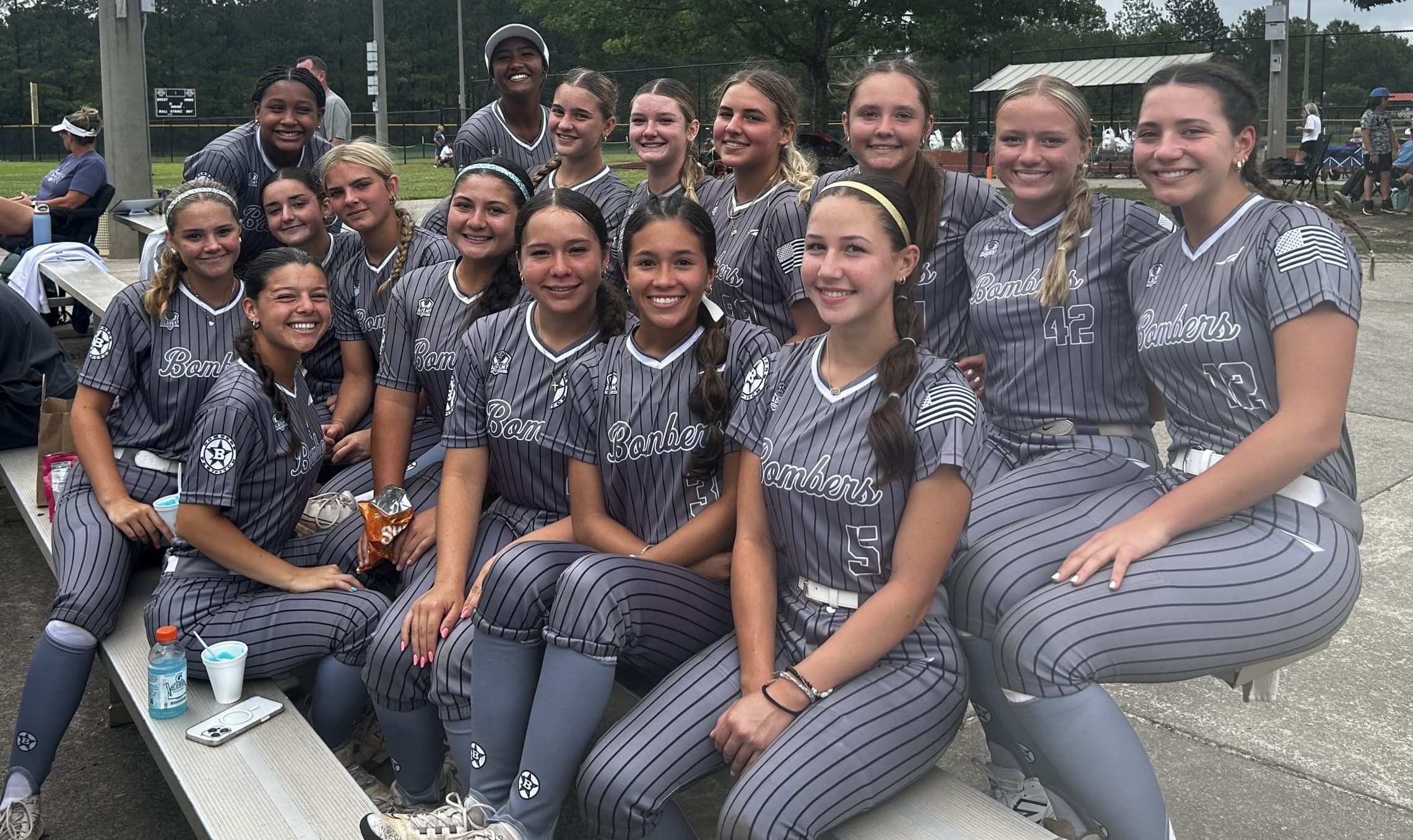 Bombers Gold 16U FL players share smiles between games at the PGF Super Grand tournament in Dalton, Ga., summer 2025.