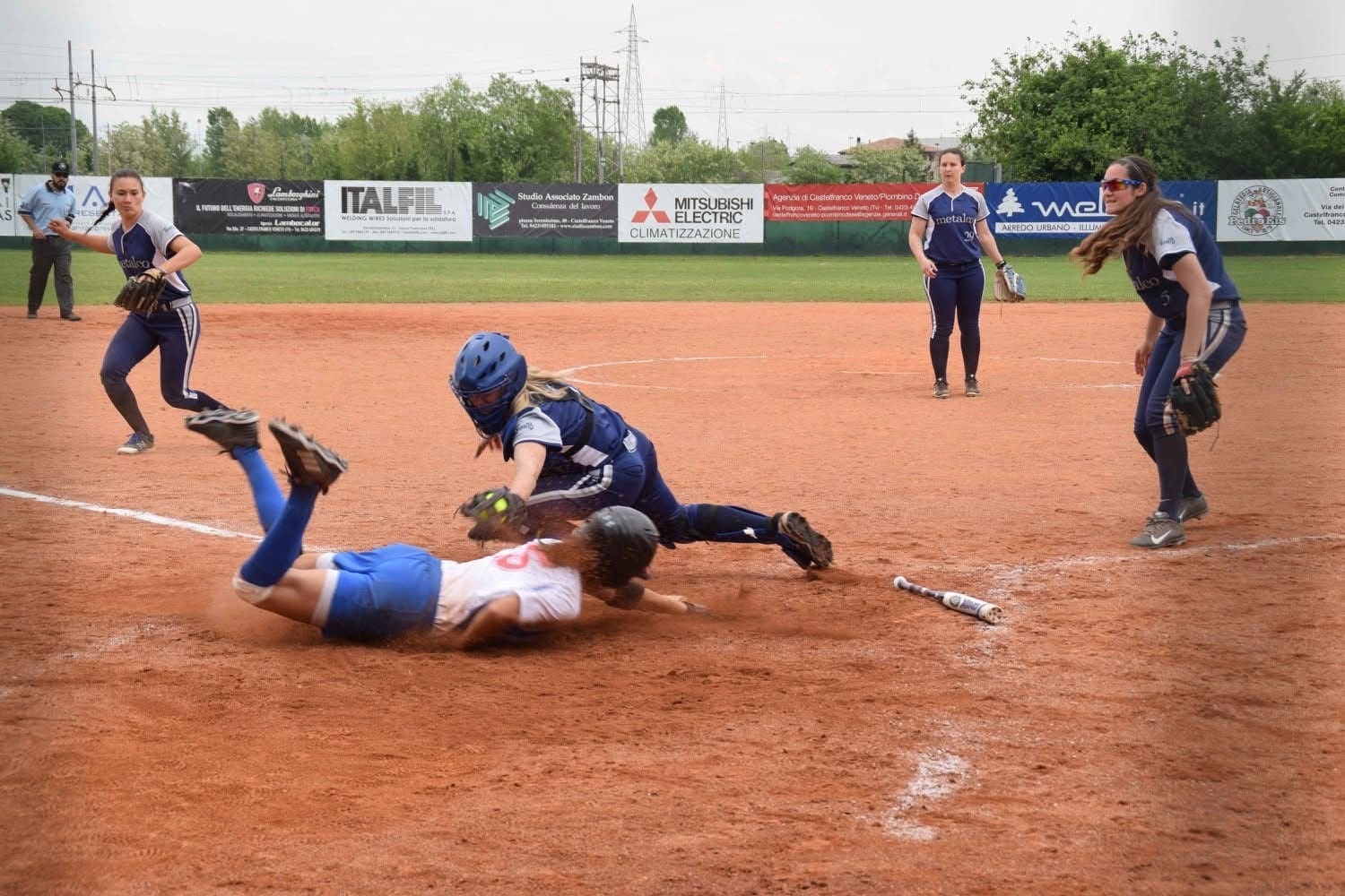 McFarland dives into home plate during a close play.v
