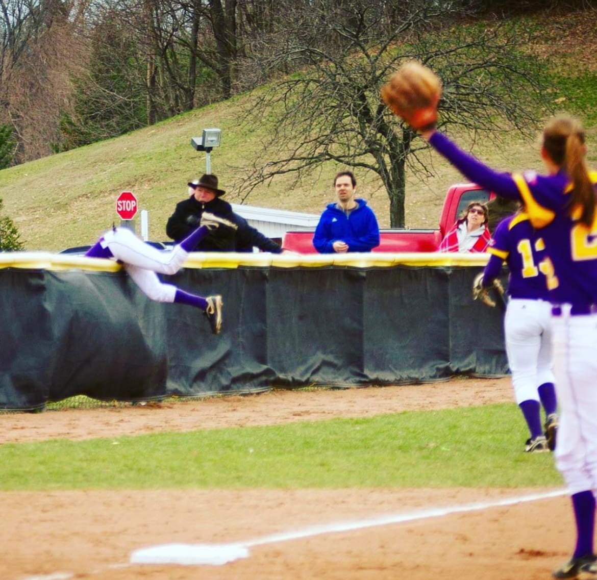 McFarland makes a leaping catch attempt near the outfield fence.