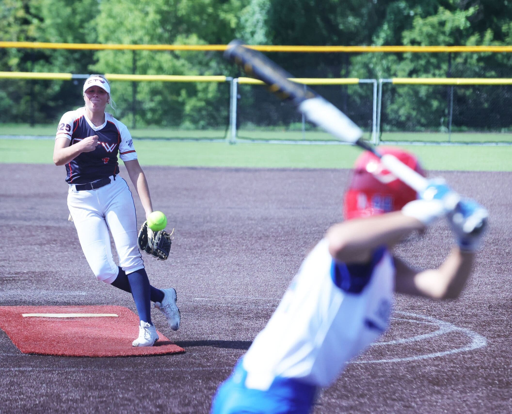 A pitcher delivers toward home during competition at the Midwest Summer Nationals in the Kansas City metro area.