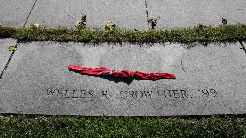 A red bandana rests on the memorial for Welles R. Crowther, Class of 1999, on campus. (Courtesy of Boston College)